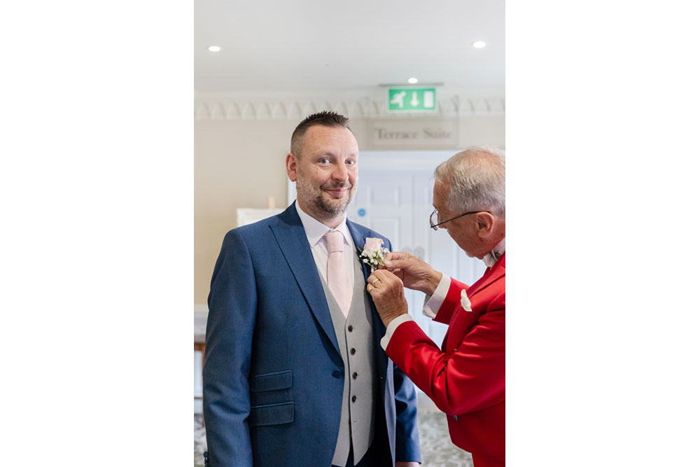 JToastmaster assisting Groom with buttonhole