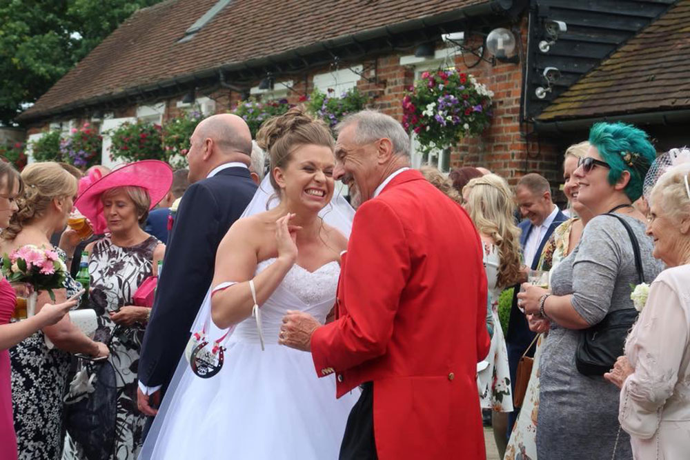 Toastmaster with happy Bride